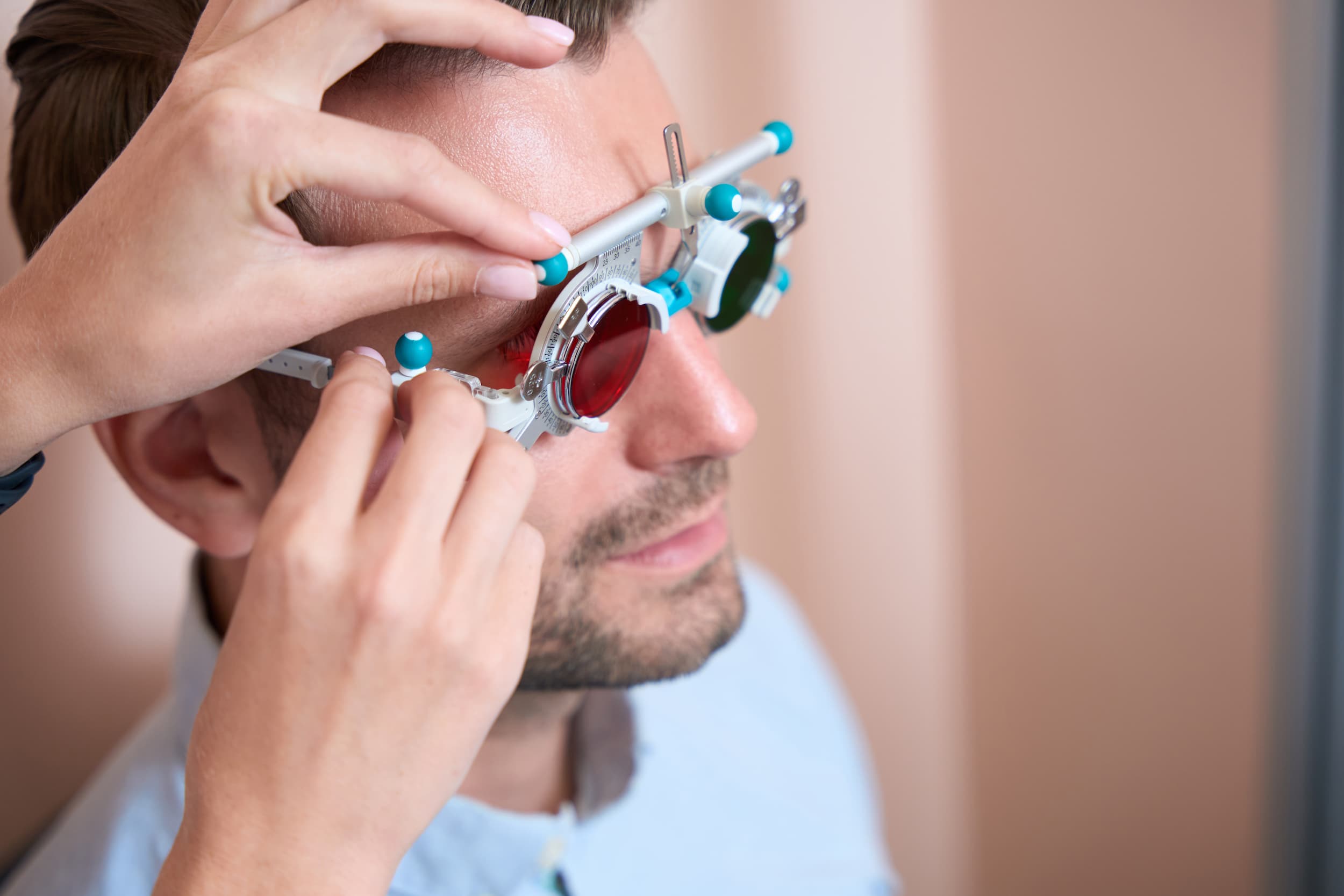 optometrist-making-adjustment-to-eye-lens