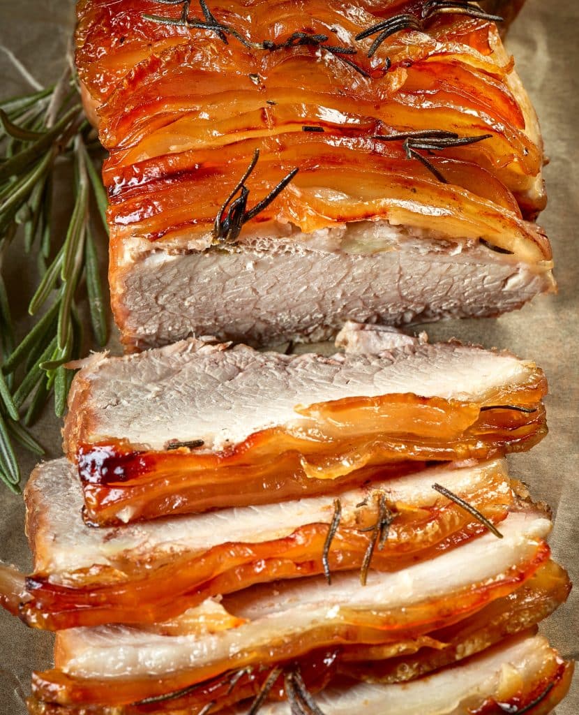 roasted pork belly slices with rosemary